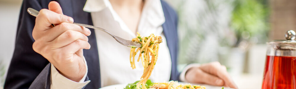 Businesswoman,Having,Lunch,With,Pasta,And,Fruit,Tea,At,The